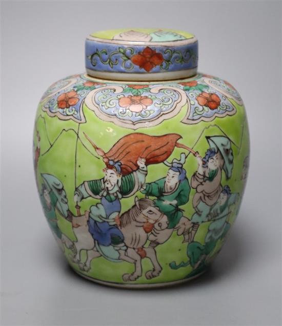 A Chinese lime green ground famille verte jar and cover, late 19th century, 15cm
